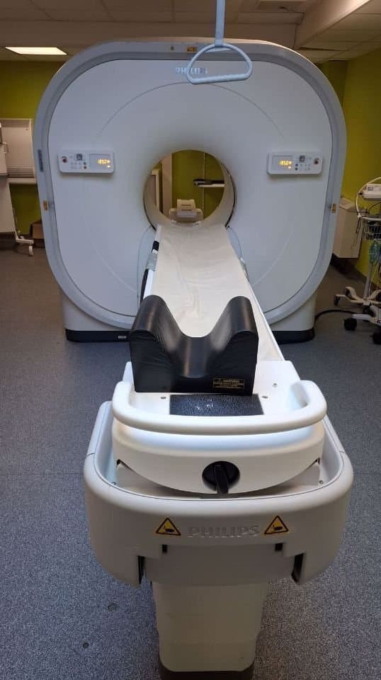 Philips Vereos 128. Patient table and gantry, front view.