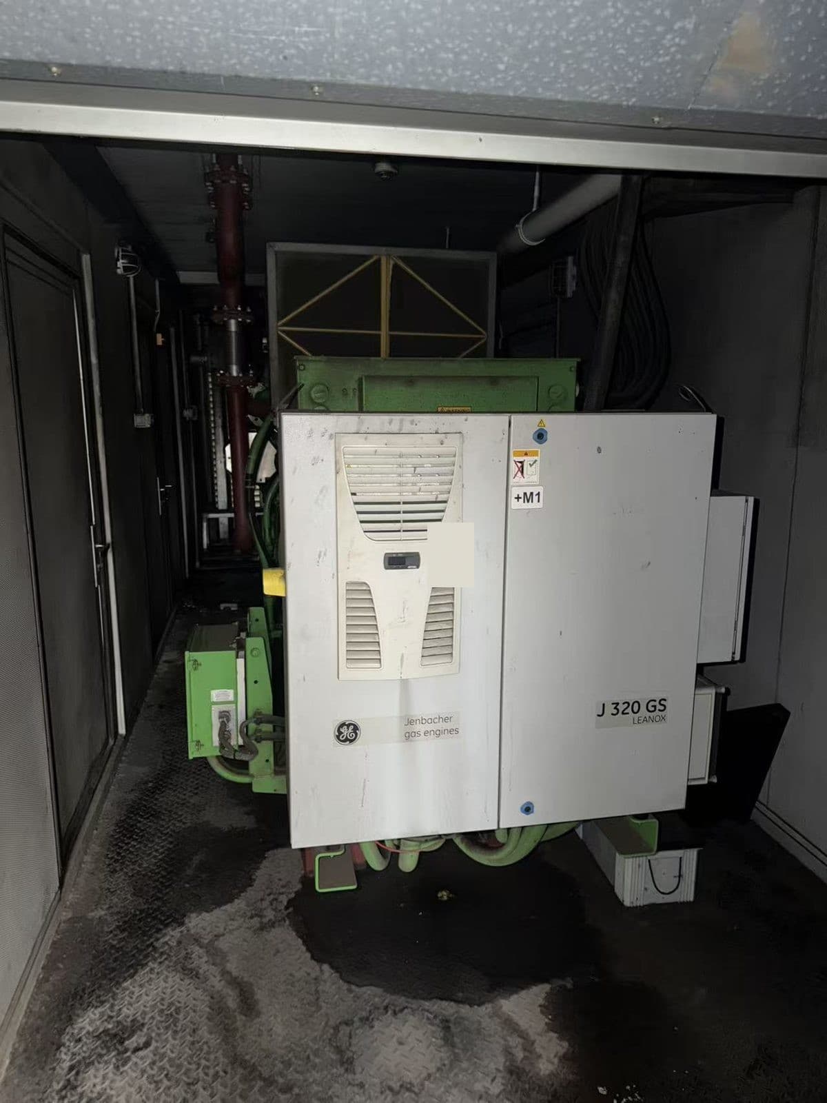 Engine control cabinet and engine bay inside a generator container